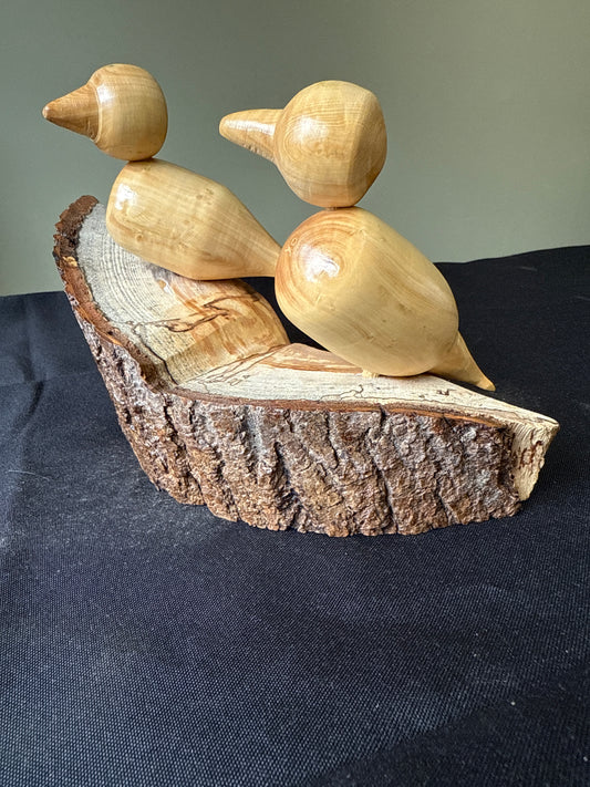 Decorative log with two boxwood birds